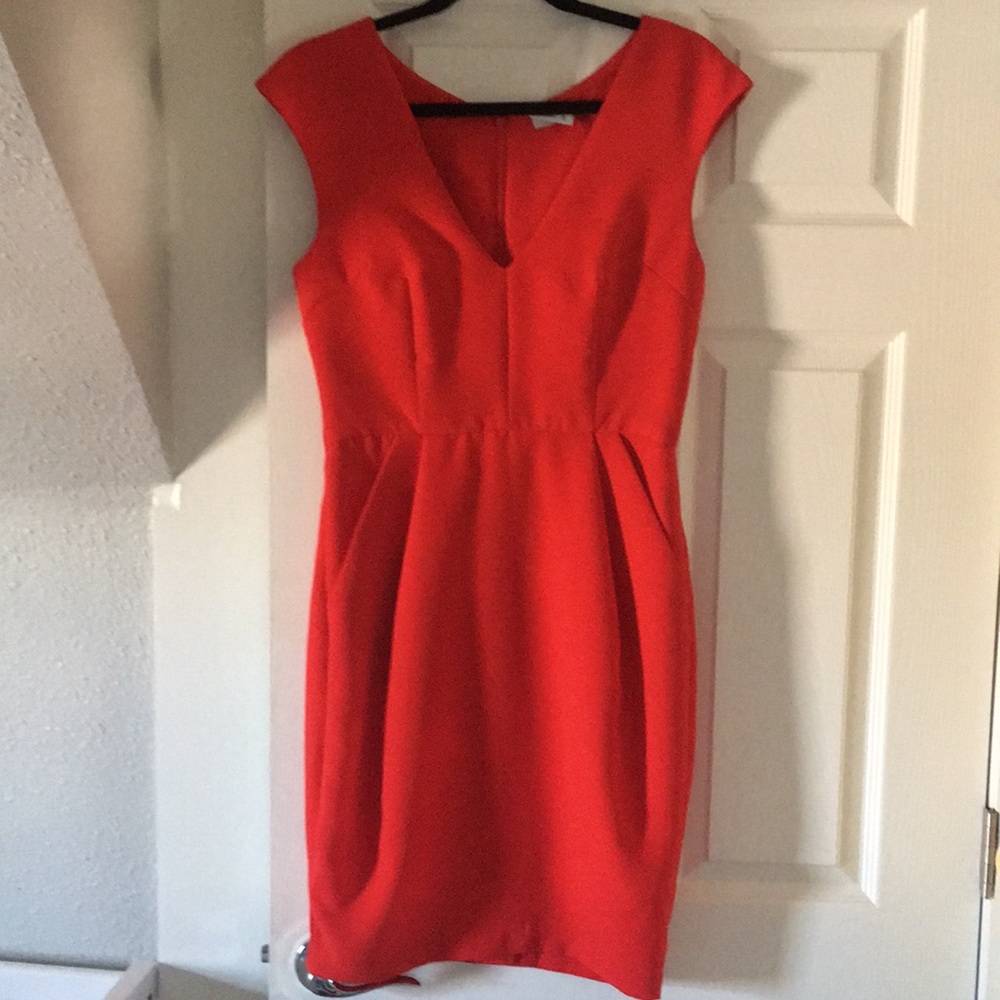 Bright red sheath dress with pockets.